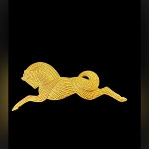 Vintage gold tone horse brooch